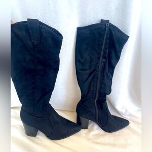 black suede knee-high boots. in excellent condition.